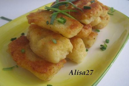 Фото к рецепту: Картофельно-сырные ньокки,жаренные в растительном масле с чили