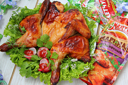 Фото к рецепту: Запеченая курица в чесночном маринаде